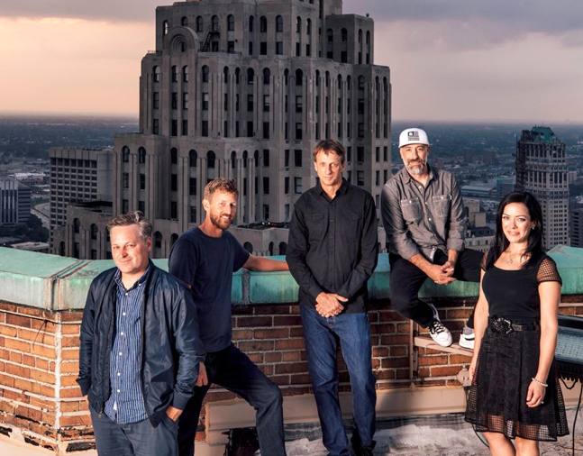 From left: D/CAL co-founders Ryan Maconochie, Jared Prindle, Tony Hawk and Adam Wilson with Katherine Huber, director of client services, atop the Guardian Building in downtown Detroit, where they have an office for their new agency.